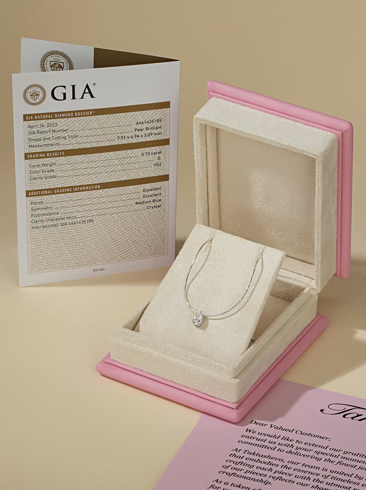 Pink velvet jewelry box with a GIA certificate